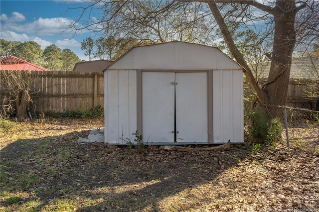 view of shed with fence