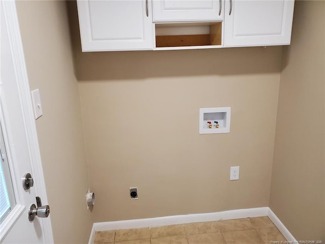 laundry room featuring electric dryer hookup, cabinet space, light tile patterned flooring, baseboards, and hookup for a washing machine