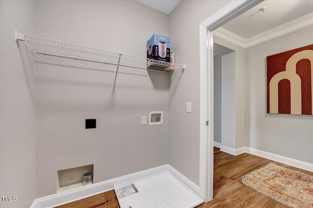 washroom featuring ornamental molding, wood finished floors, hookup for an electric dryer, hookup for a washing machine, and laundry area