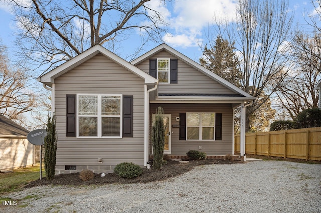 bungalow-style house with crawl space and fence