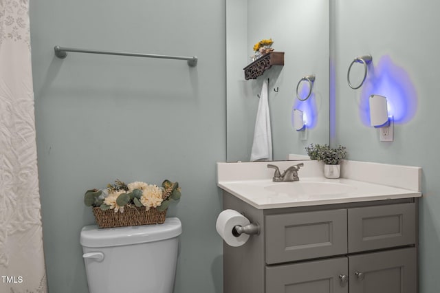 bathroom with vanity and toilet