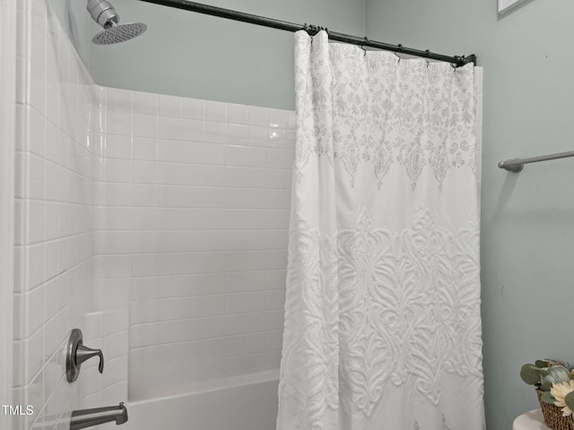 full bath featuring shower / tub combo with curtain