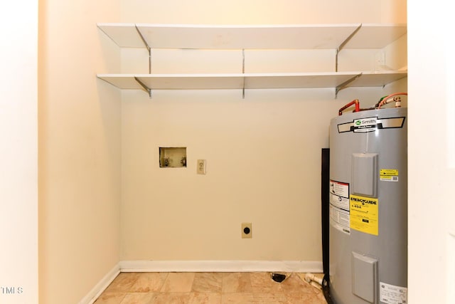 laundry room with electric dryer hookup, washer hookup, electric water heater, baseboards, and laundry area