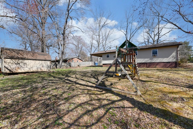 view of yard with an outdoor structure and a playground