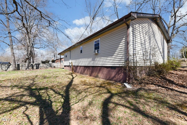 view of home's exterior featuring a yard