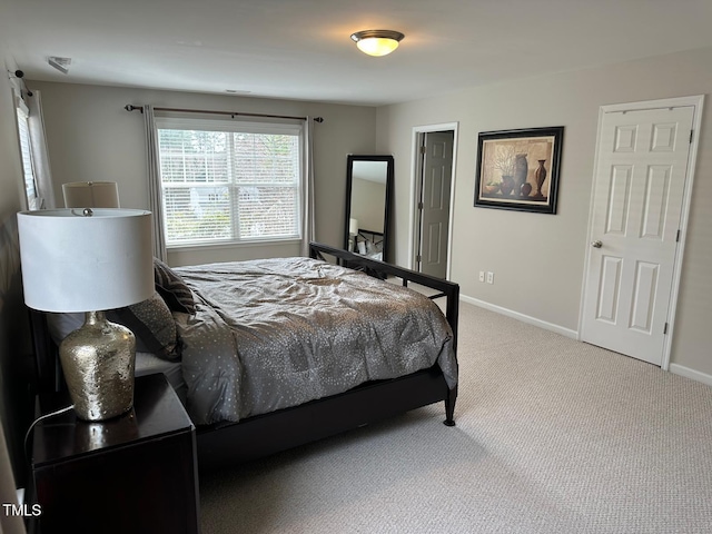 carpeted bedroom with baseboards