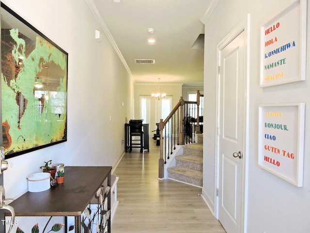 519 Flat Ford Rd, Hillsborough, NC 27278 - interior space featuring stairs, ornamental molding, light wood-style floors, visible vents, and a notable chandelier