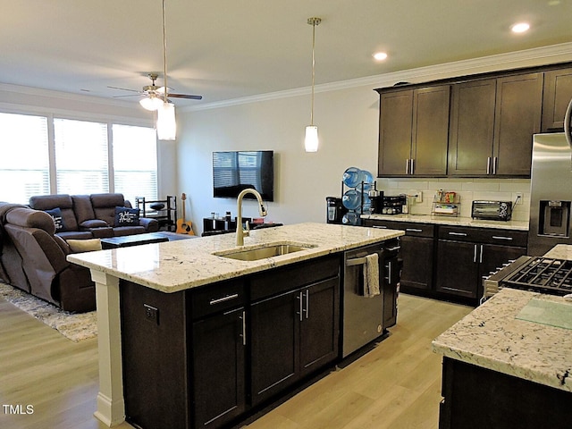 519 Flat Ford Rd, Hillsborough, NC 27278 - kitchen with crown molding, a sink, appliances with stainless steel finishes, open floor plan, and light wood-style flooring