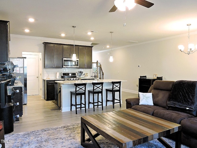 519 Flat Ford Rd, Hillsborough, NC 27278 - living area with light wood-style flooring, recessed lighting, ceiling fan with notable chandelier, and crown molding