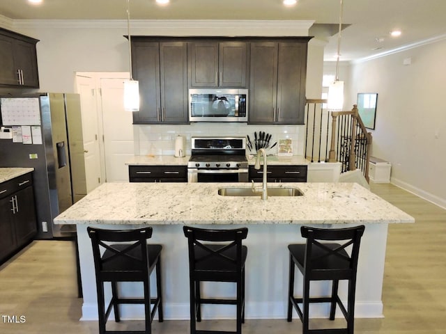 519 Flat Ford Rd, Hillsborough, NC 27278 - kitchen with crown molding, light wood finished floors, stainless steel appliances, a sink, and backsplash