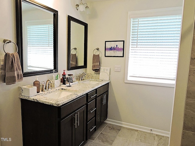 519 Flat Ford Rd, Hillsborough, NC 27278 - bathroom with baseboards, a sink, and a healthy amount of sunlight