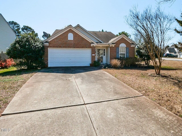 ranch-style home with brick siding, an attached garage, and concrete driveway