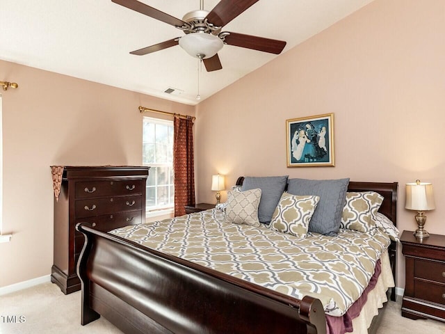 bedroom with visible vents, baseboards, lofted ceiling, light carpet, and a ceiling fan