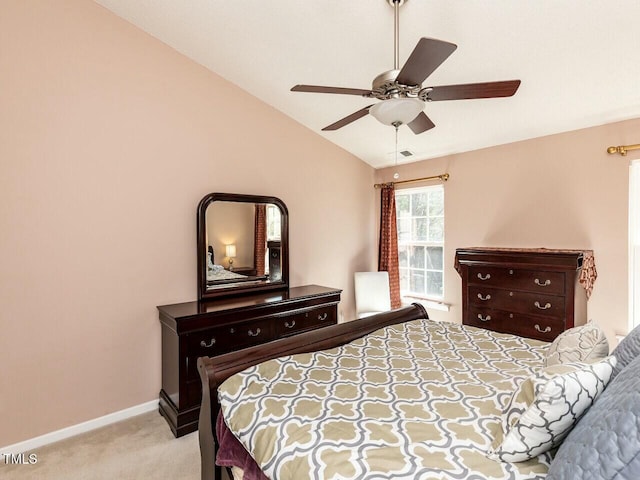 bedroom featuring visible vents, baseboards, carpet, lofted ceiling, and a ceiling fan