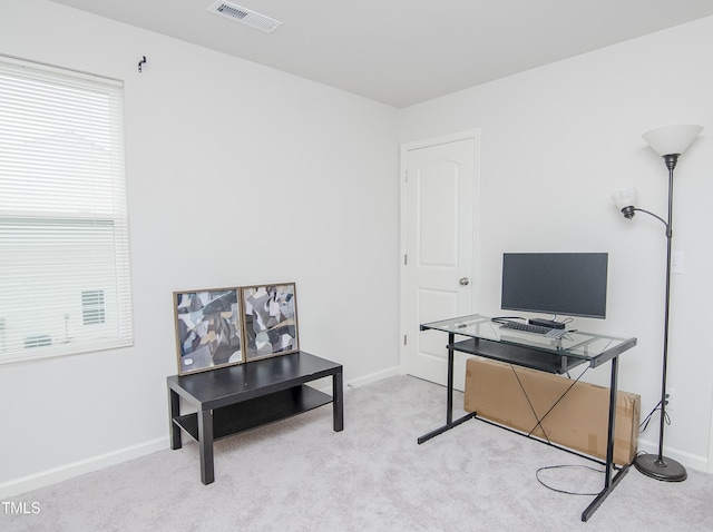 carpeted home office with baseboards and visible vents