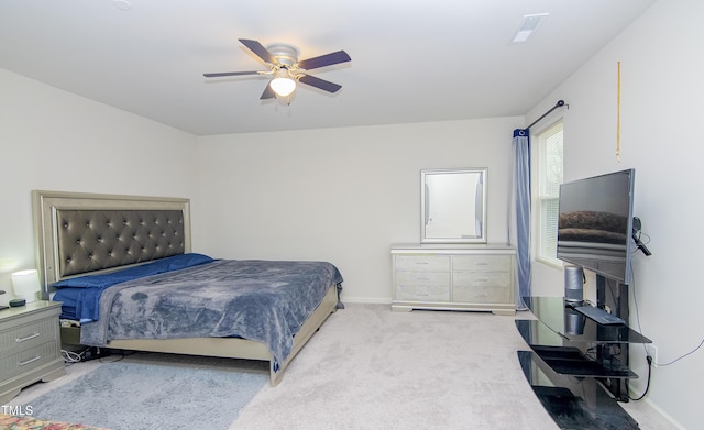 bedroom featuring a ceiling fan, baseboards, and carpet floors