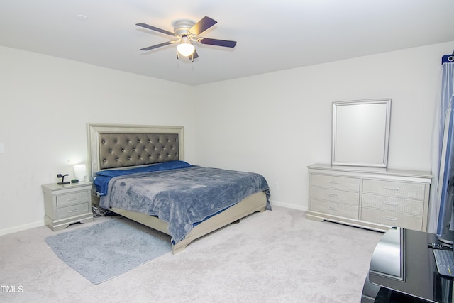 bedroom featuring a ceiling fan, baseboards, and carpet floors