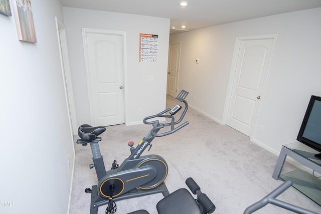 exercise room featuring carpet flooring, recessed lighting, and baseboards