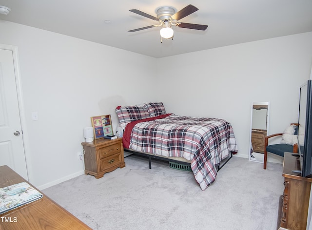 bedroom featuring a ceiling fan, carpet, and baseboards