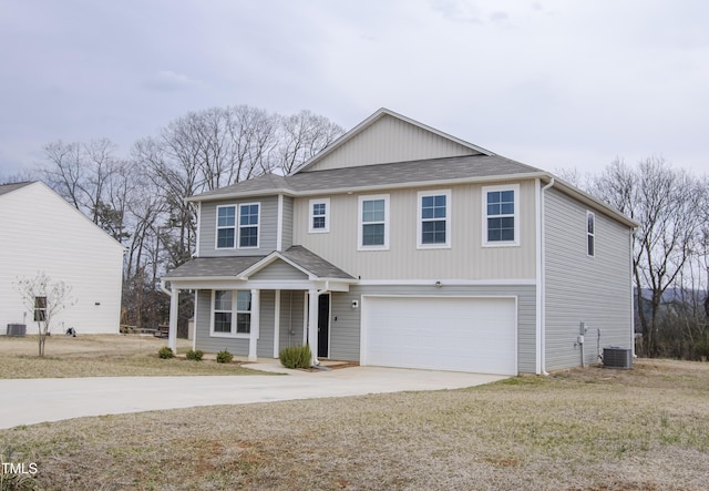 view of front of home featuring a garage, covered porch, roof with shingles, and driveway