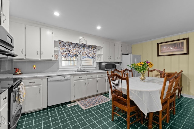 kitchen featuring a sink, open shelves, white cabinets, and stainless steel appliances