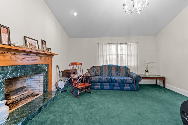 carpeted living area with a high end fireplace, baseboards, and vaulted ceiling