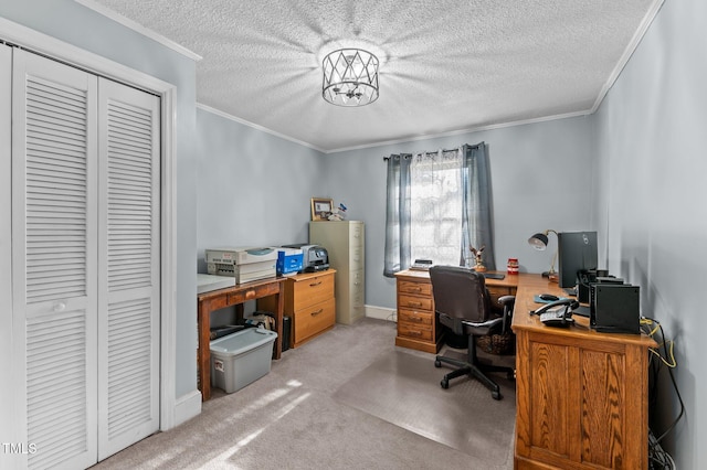 home office with baseboards, a textured ceiling, ornamental molding, and carpet flooring