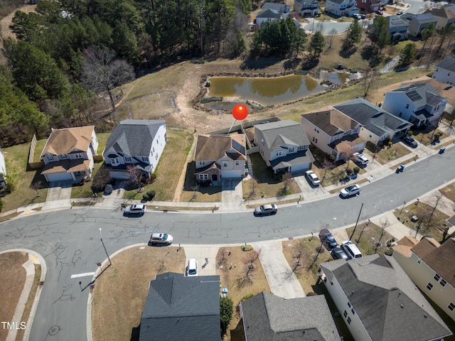 aerial view with a residential view and a water view