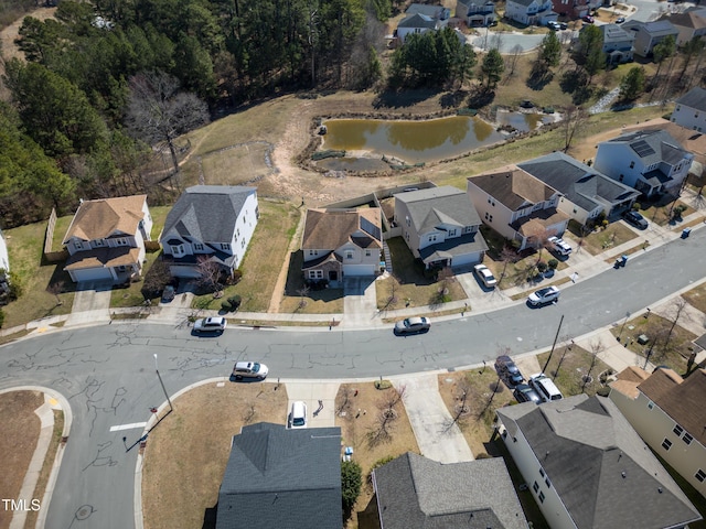 aerial view with a residential view and a water view