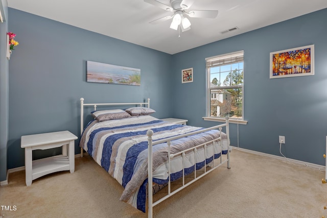 carpeted bedroom featuring visible vents, ceiling fan, and baseboards