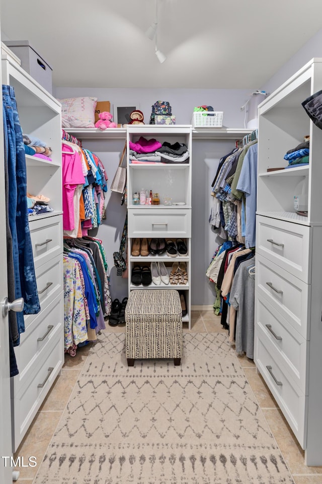 walk in closet featuring light tile patterned floors