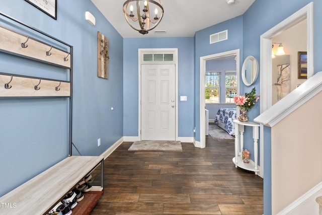 mudroom with visible vents, baseboards, a notable chandelier, and dark wood-style floors