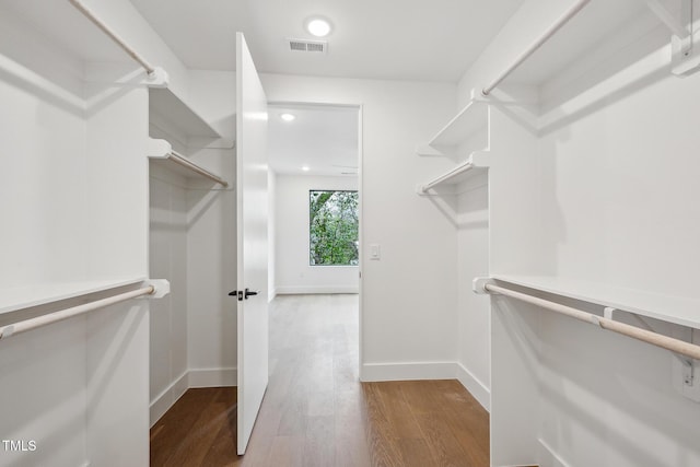 spacious closet with visible vents and wood finished floors