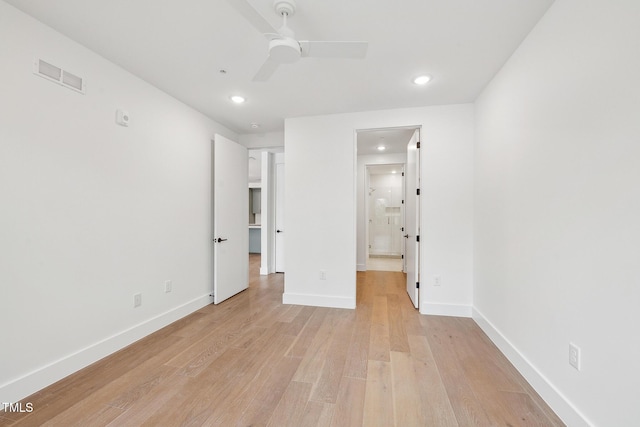 unfurnished bedroom featuring light wood-type flooring, visible vents, ensuite bathroom, recessed lighting, and baseboards