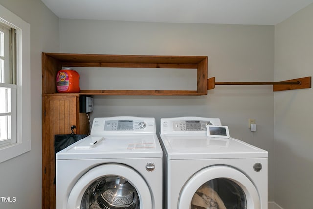 laundry area with laundry area and washer and clothes dryer