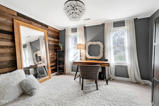 carpeted home office featuring visible vents, a healthy amount of sunlight, ornamental molding, and an inviting chandelier