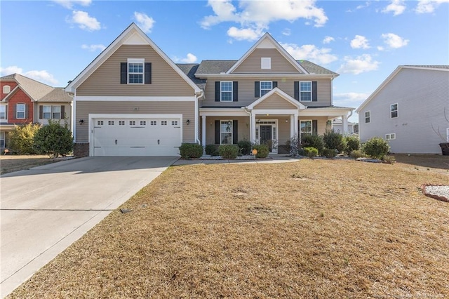 view of front facade with a front lawn, an attached garage, and driveway