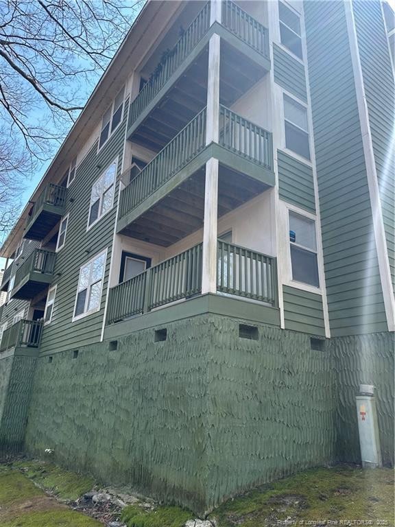 view of property exterior with crawl space