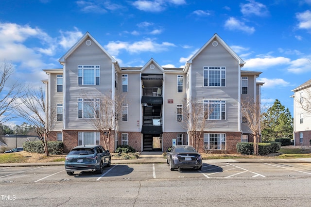 view of property featuring uncovered parking