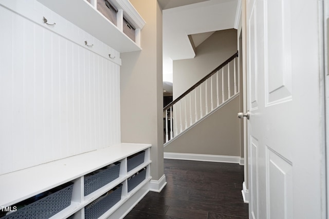 mudroom featuring dark wood-style floors and baseboards