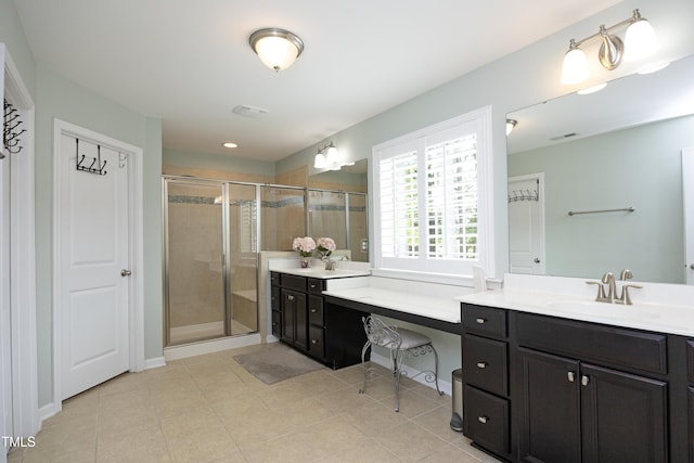 bathroom with tile patterned flooring, visible vents, a shower stall, and vanity