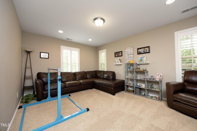 carpeted living room featuring visible vents, recessed lighting, and baseboards