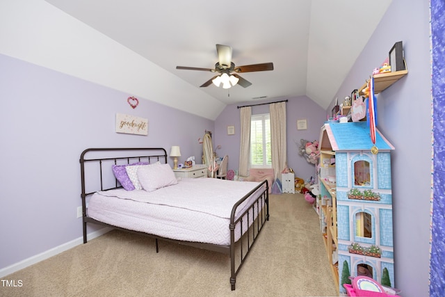 carpeted bedroom with lofted ceiling, a ceiling fan, baseboards, and visible vents