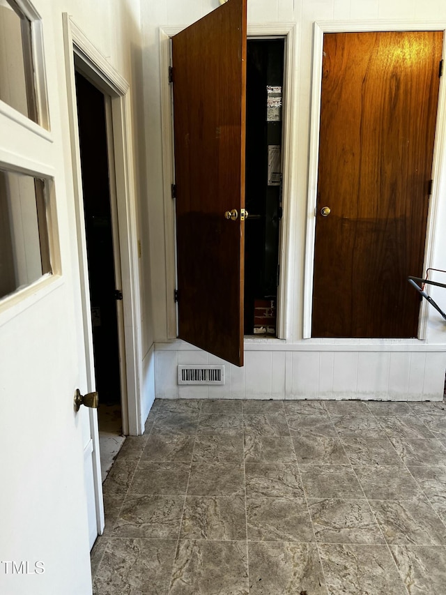 hallway featuring visible vents