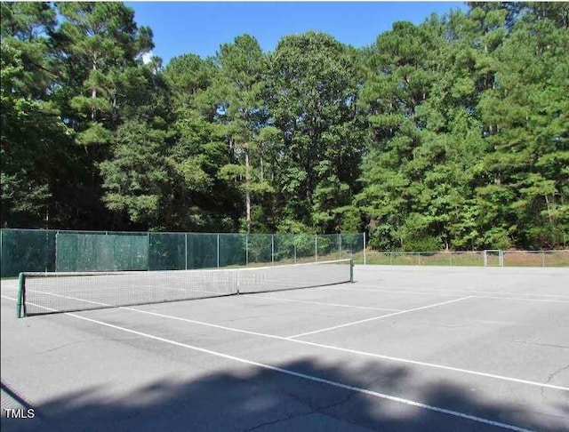 view of sport court with fence