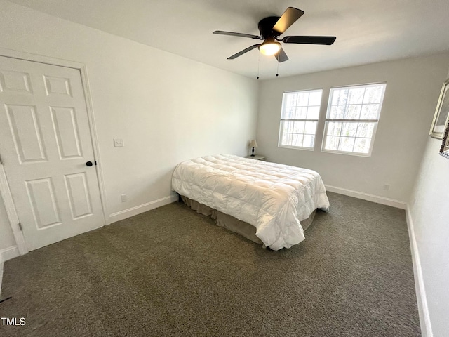 bedroom with dark carpet, baseboards, and a ceiling fan