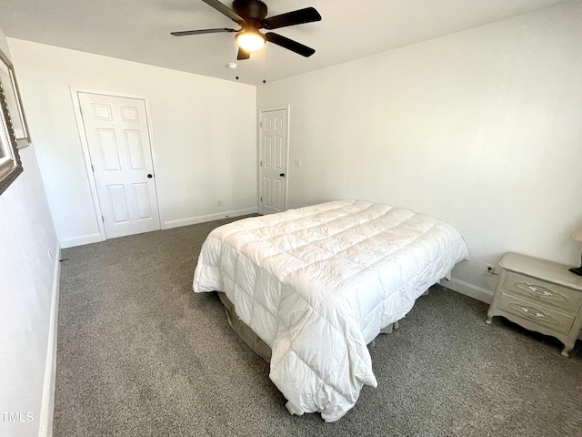 carpeted bedroom featuring baseboards and a ceiling fan