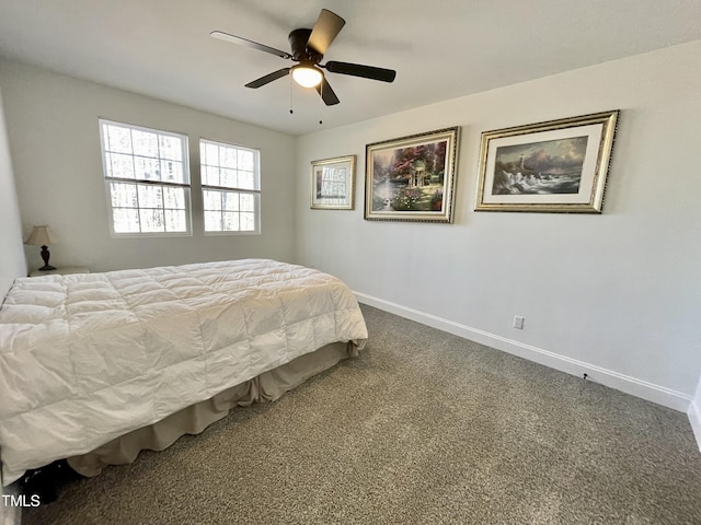carpeted bedroom featuring baseboards and a ceiling fan
