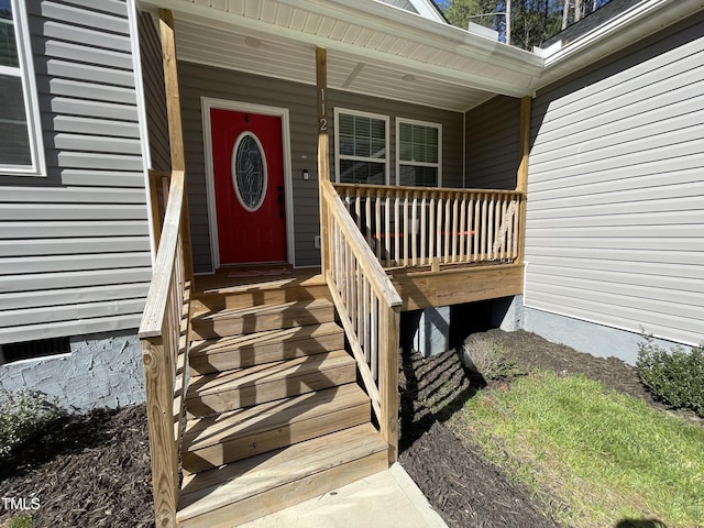 property entrance with covered porch