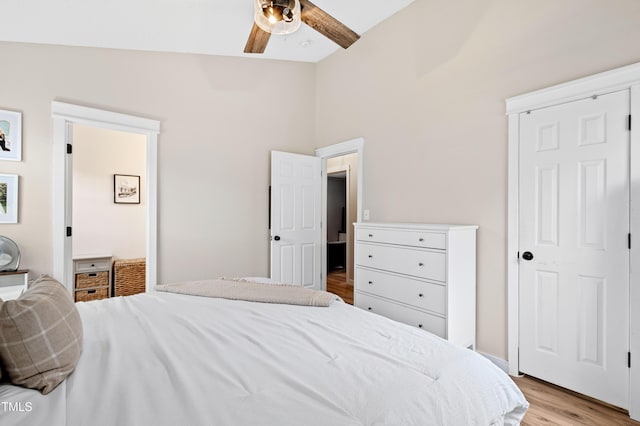 bedroom with light wood-style flooring and a ceiling fan